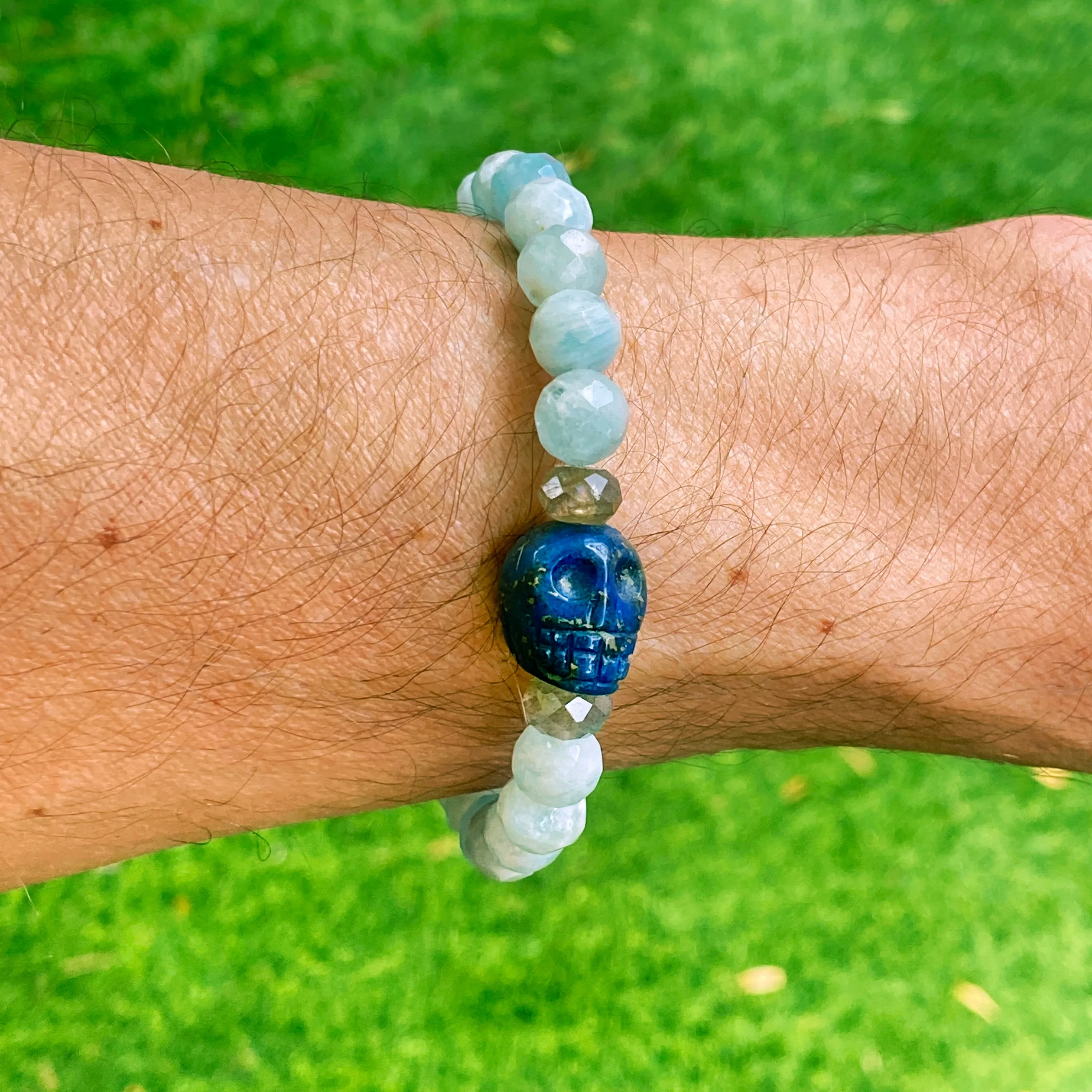 Lapis lazuli skull, pyrite, Labradorite, and blue sapphire stretch bracelet