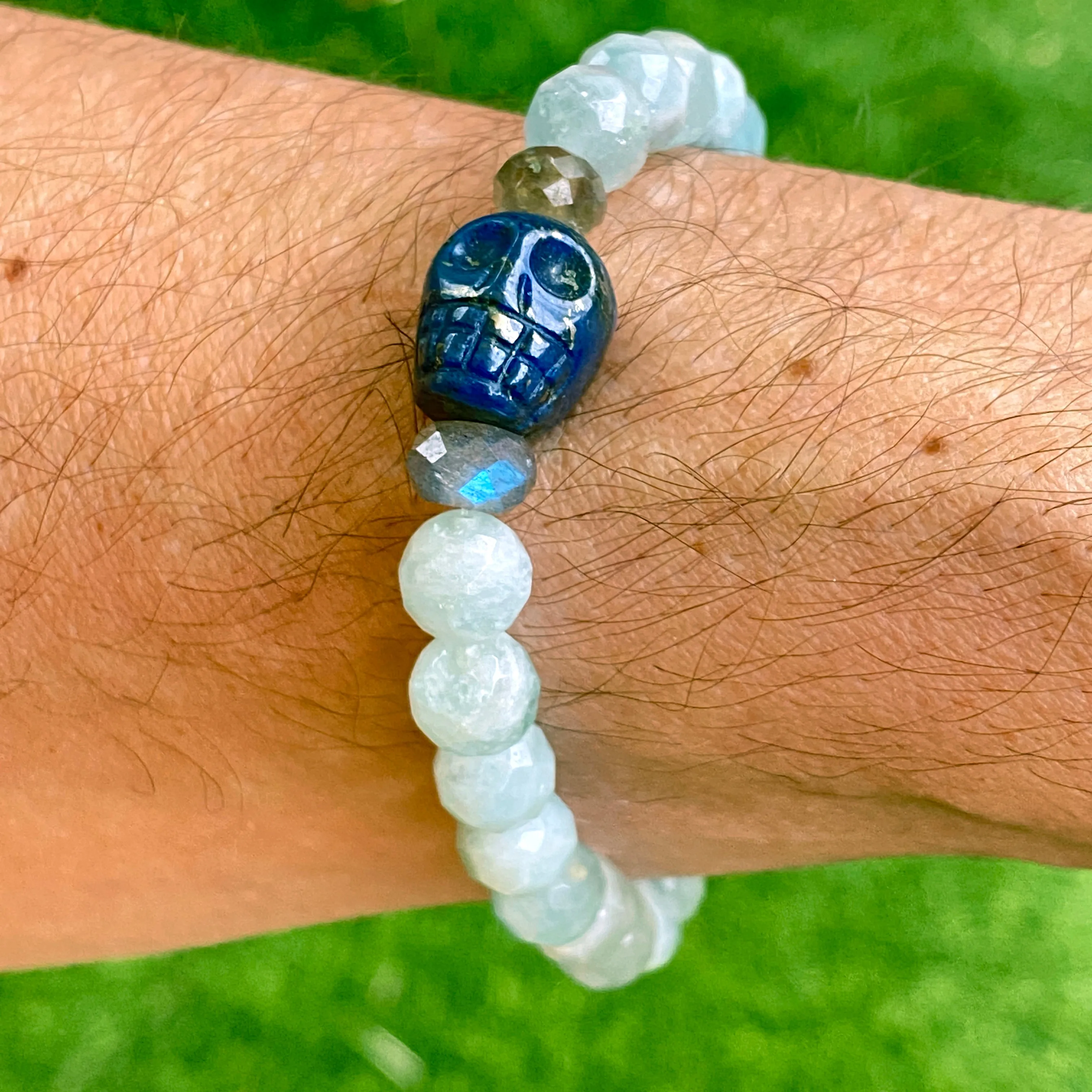 Lapis lazuli skull, pyrite, Labradorite, and blue sapphire stretch bracelet